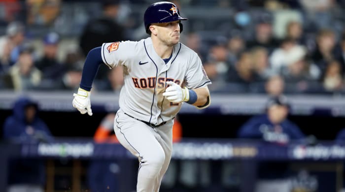 Astros third baseman Alex Bregman runs to first base